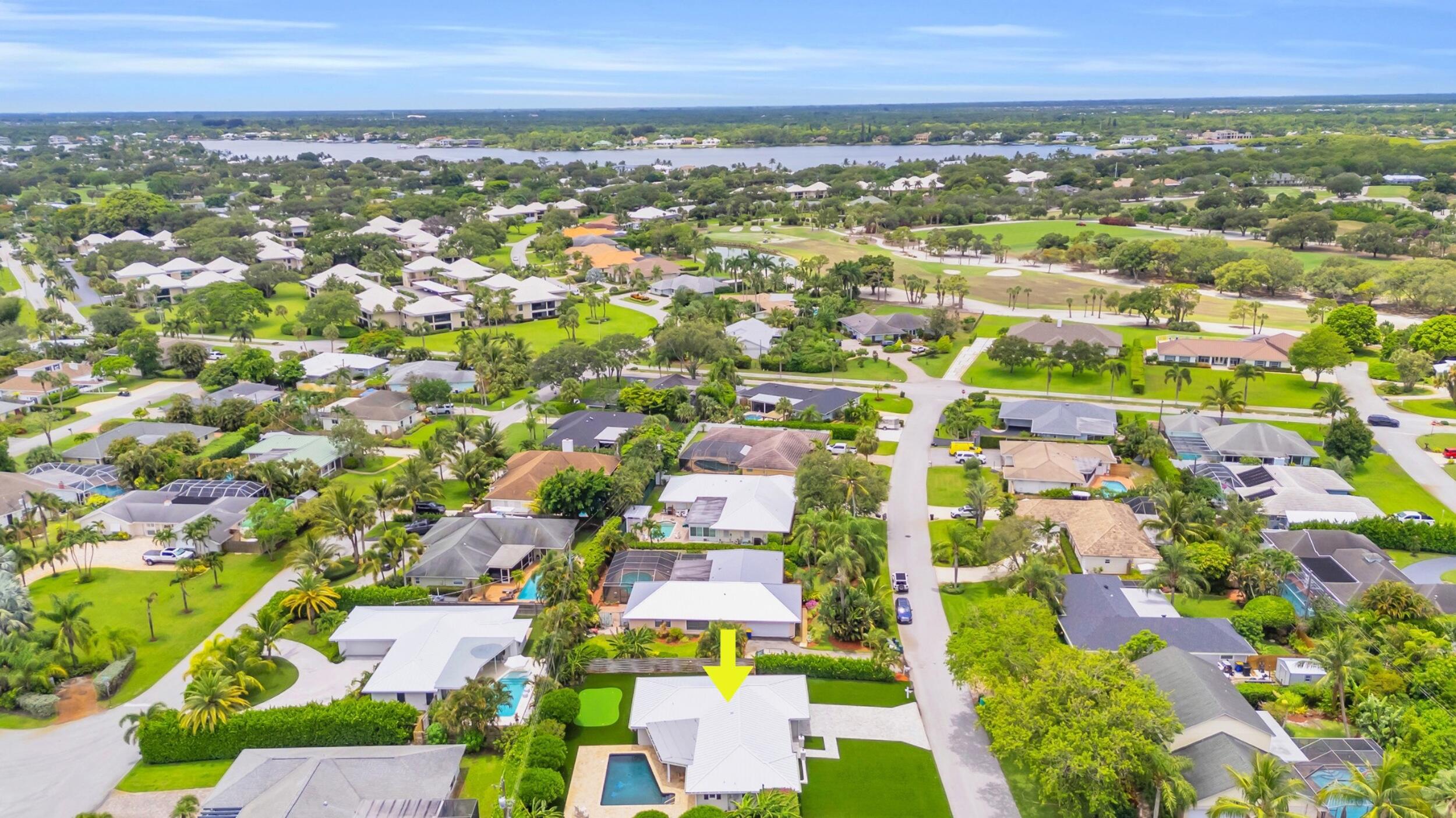11 Southeast Splitrail Circle Jupiter, FL 33469 - Photo 47 of 48 an aerial view of residential building with outdoor space and trees
