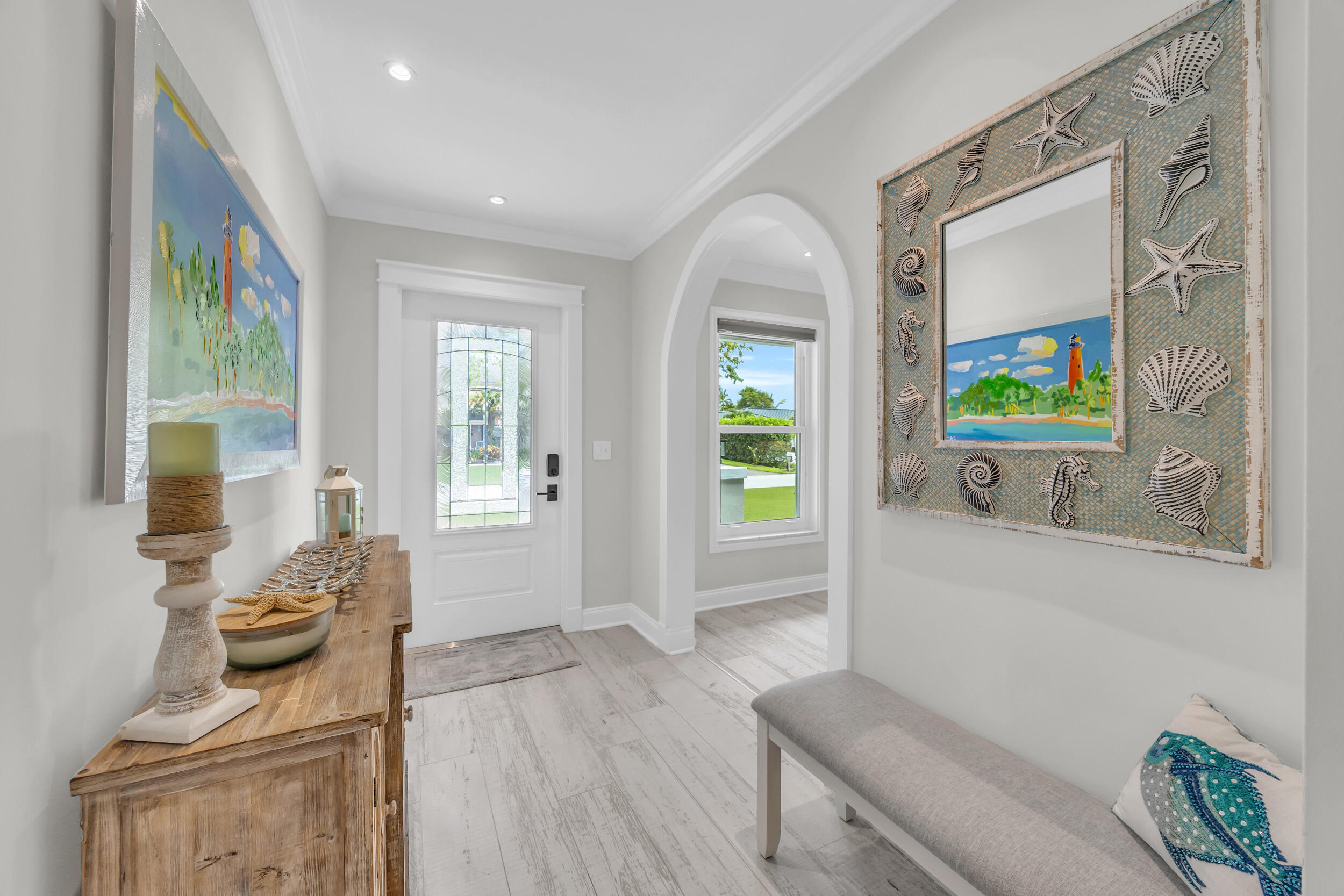 11 Southeast Splitrail Circle Jupiter, FL 33469 - Photo 6 of 48 a living room with furniture and a wooden floor