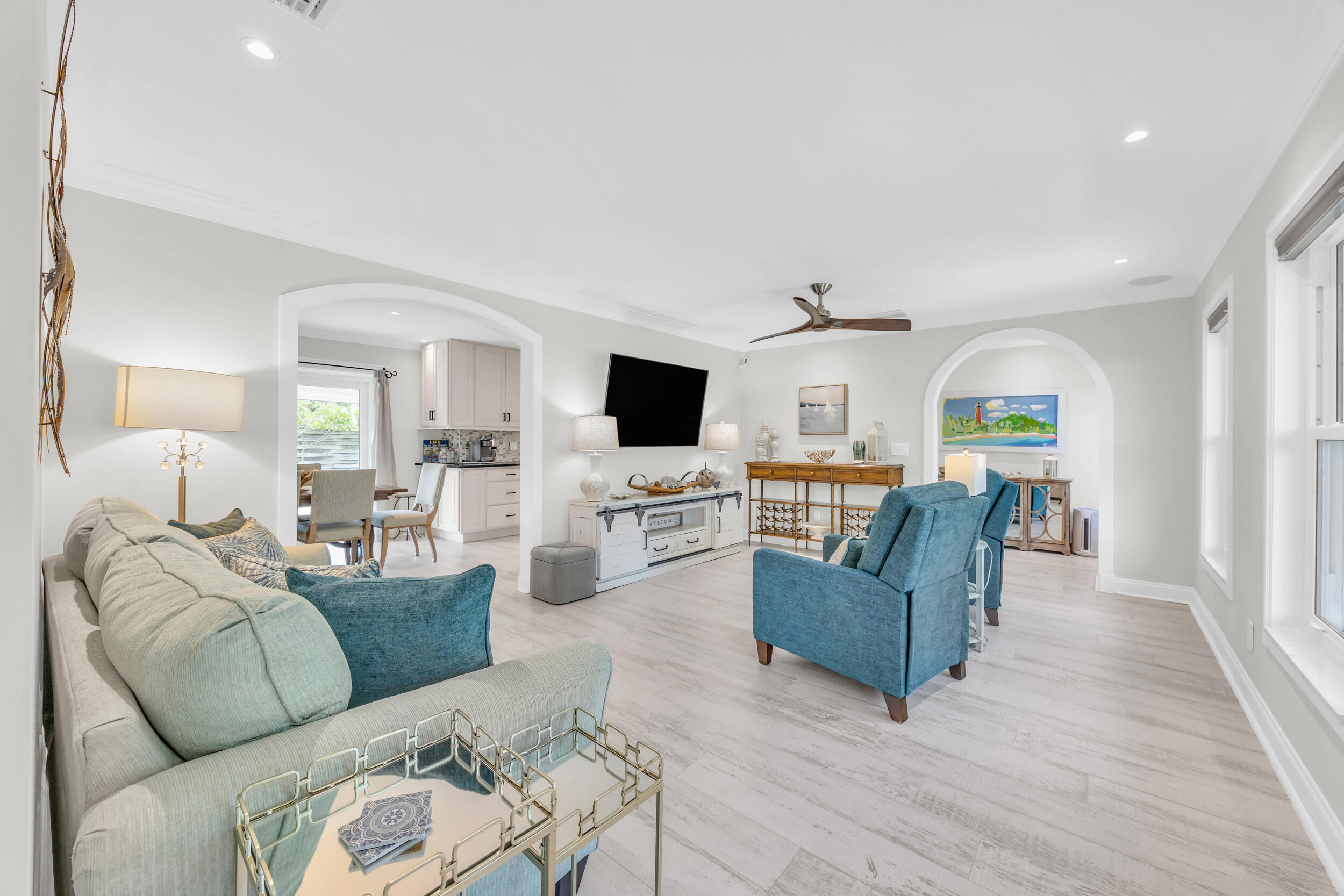11 Southeast Splitrail Circle Jupiter, FL 33469 - Photo 8 of 48 a living room with furniture and a flat screen tv