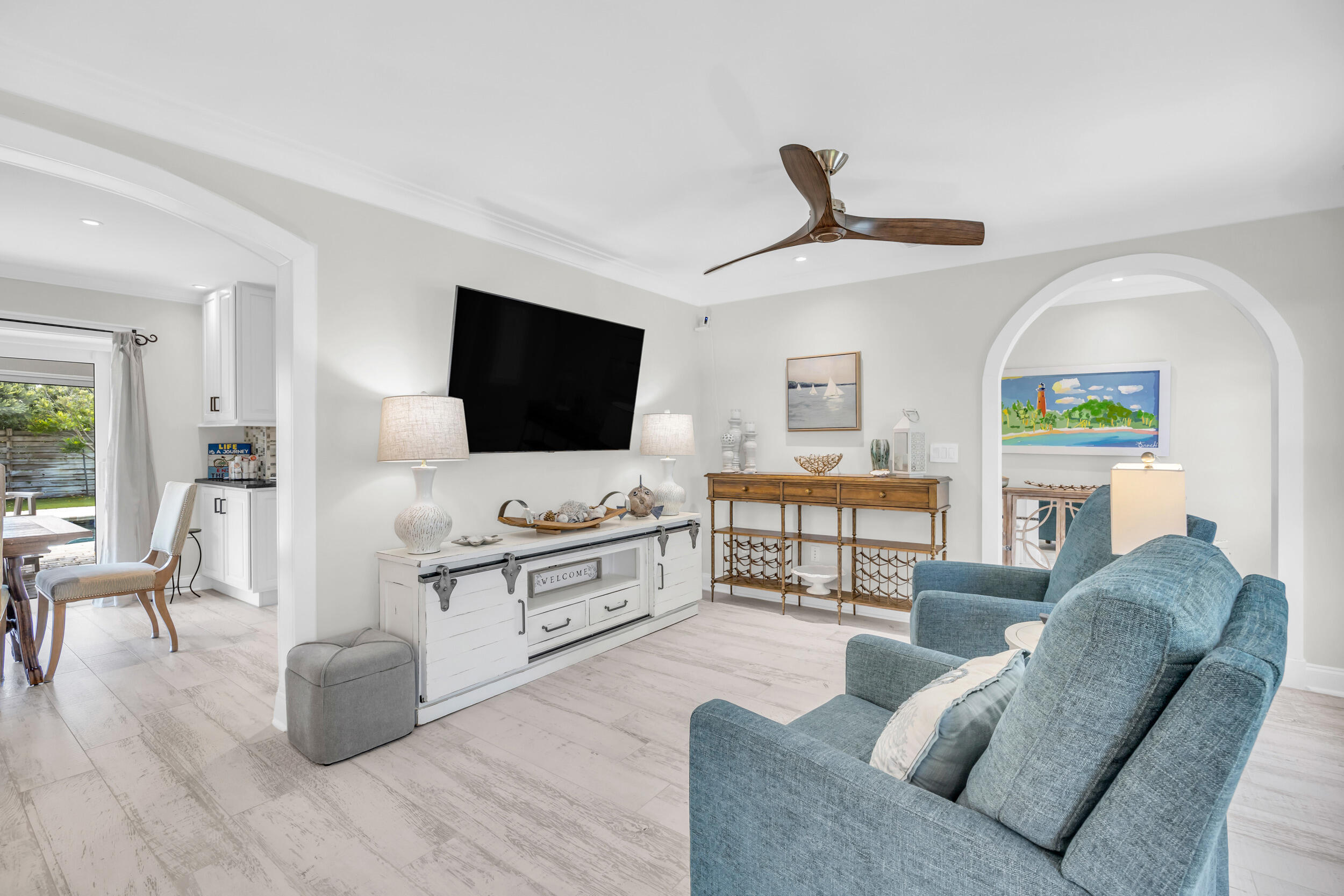 11 Southeast Splitrail Circle Jupiter, FL 33469 - Photo 9 of 48 a living room with furniture and a flat screen tv