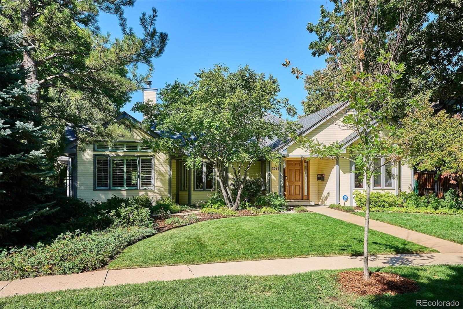 2363 South Adams Street Denver, CO 80210 - Photo 2 of 50 a front view of a house with garden
