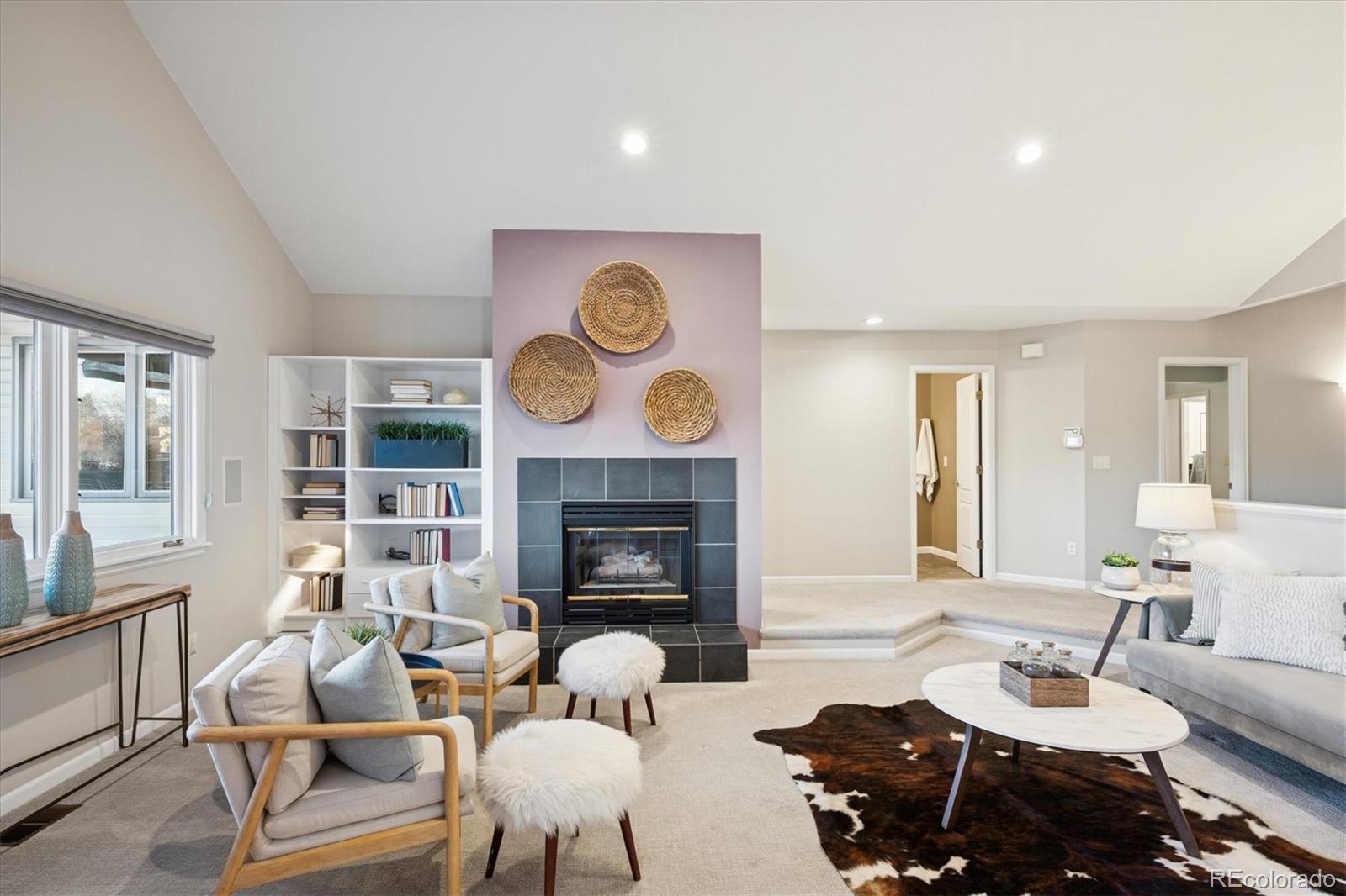 2363 South Adams Street Denver, CO 80210 - Photo 21 of 50 a living room with furniture and a fireplace