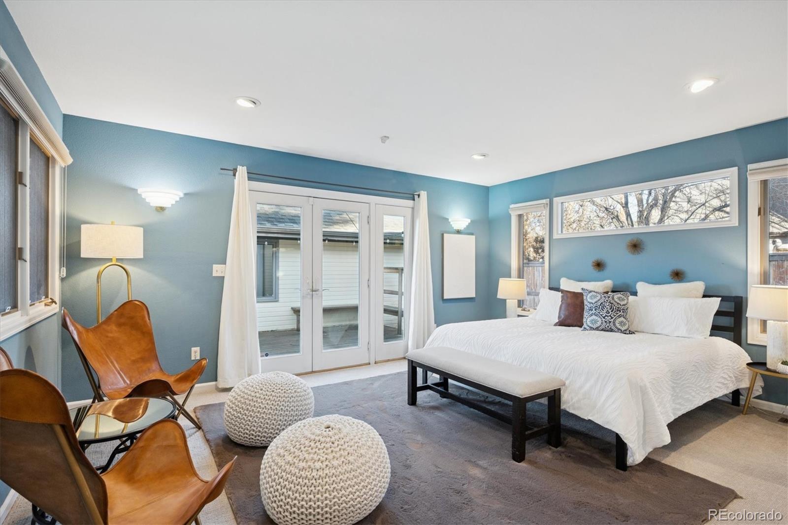 2363 South Adams Street Denver, CO 80210 - Photo 25 of 50 a bedroom with a bed and glass windows