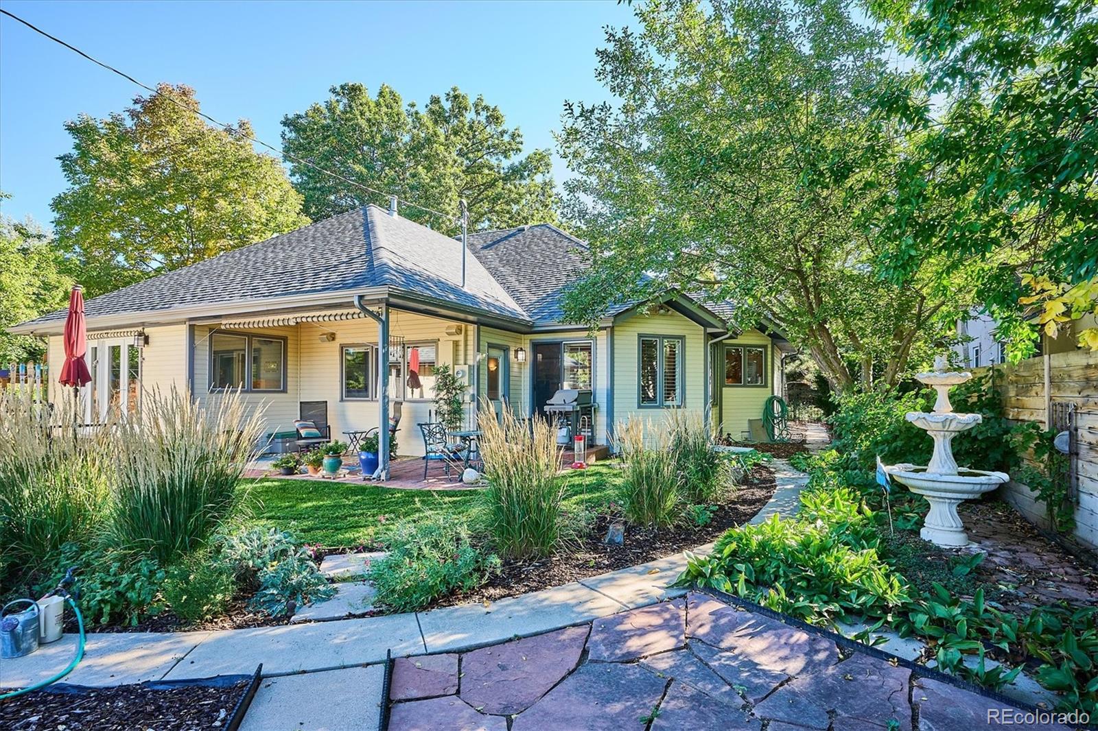 2363 South Adams Street Denver, CO 80210 - Photo 40 of 50 a front view of a house with garden