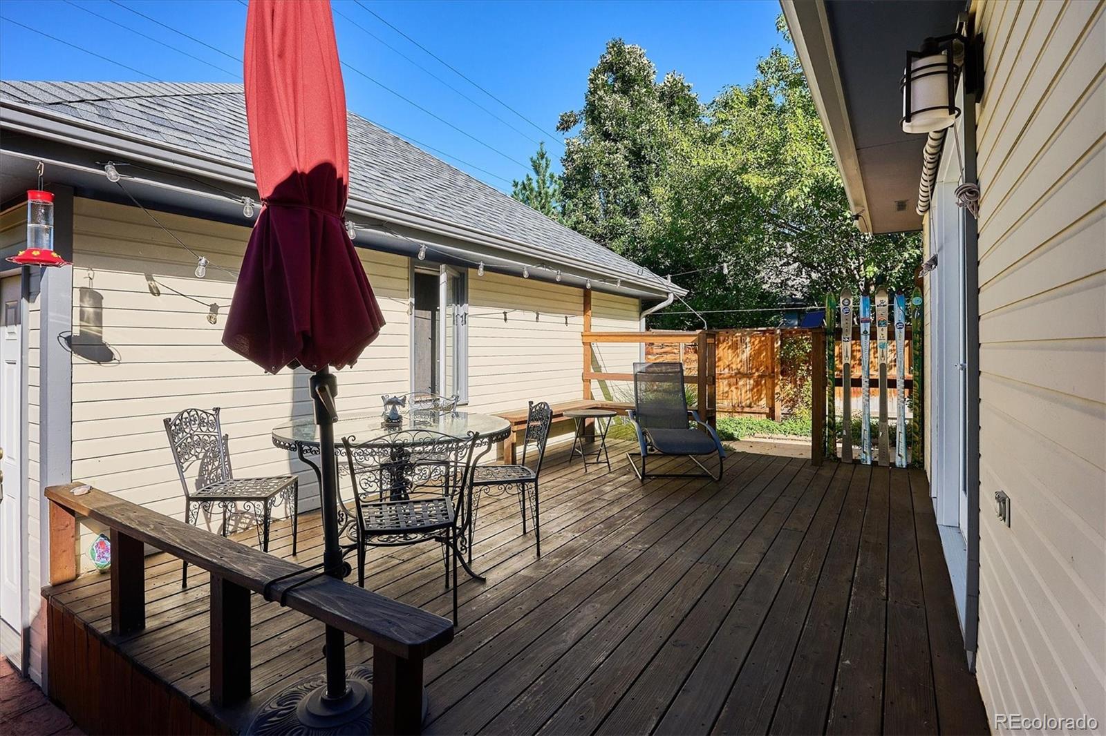 2363 South Adams Street Denver, CO 80210 - Photo 43 of 50 a view of balcony with wooden floor and outdoor seating