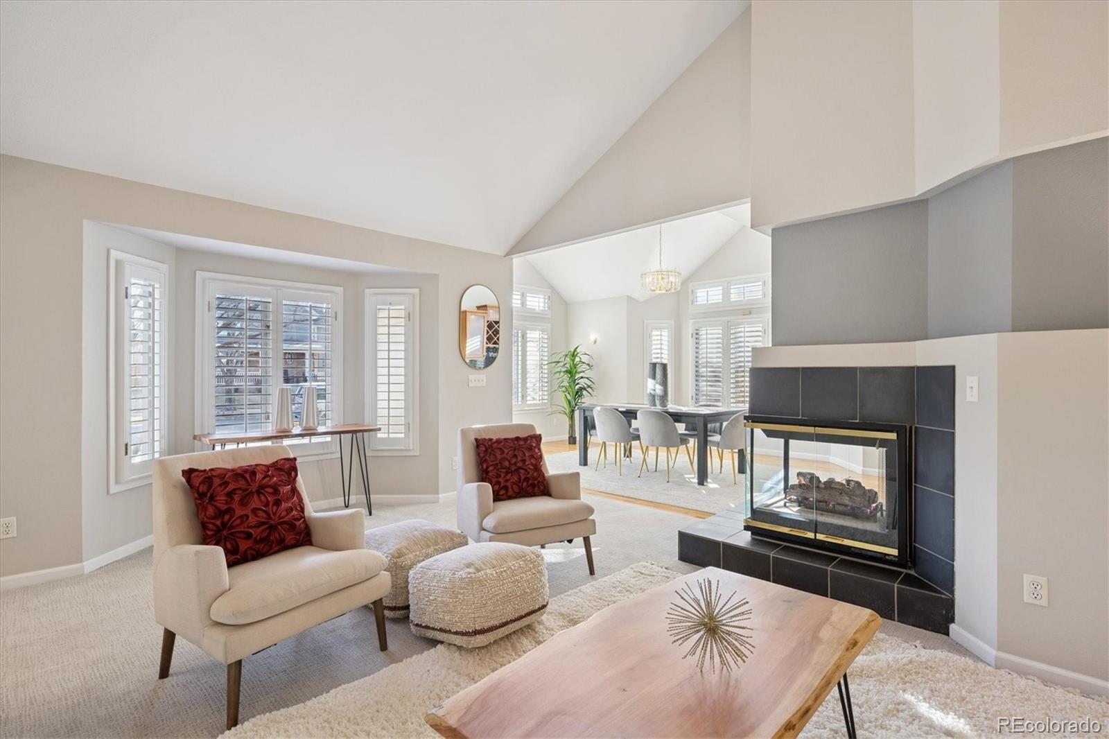 2363 South Adams Street Denver, CO 80210 - Photo 9 of 50 a living room with furniture and a fireplace