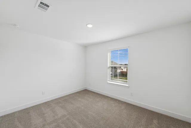 a bathroom with a shower and a toilet