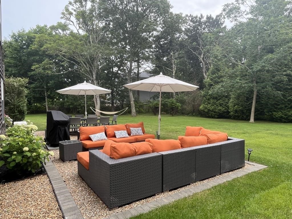 13 Young Street Edgartown, MA 02539 - Photo 20 of 29 a view of outdoor sitting area with chairs and backyard