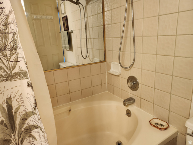 860 South Village Road, Unit Z10 St. George, UT 84770 - Photo 8 of 18 Full bathroom featuring toilet and shower / bathtub combination with curtain