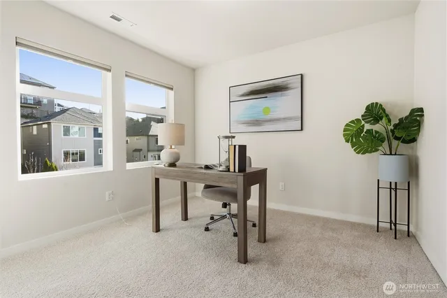 a view of a workspace with furniture