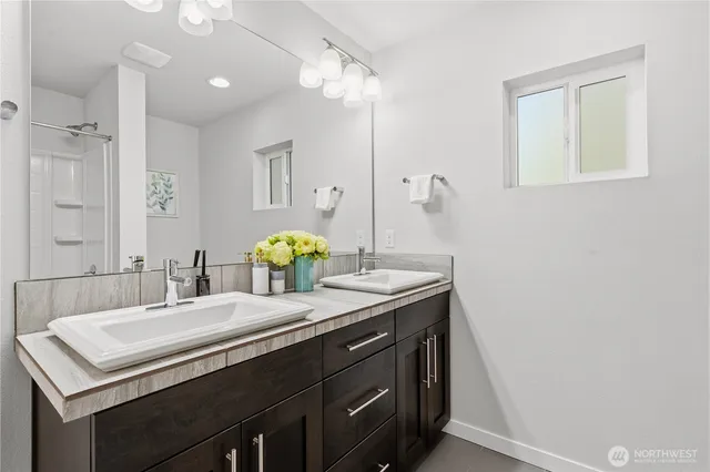 a bathroom with a sink and a mirror