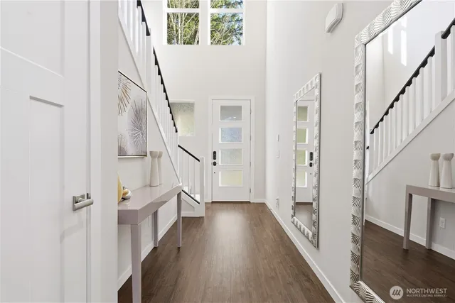 a view of an entryway with wooden floor