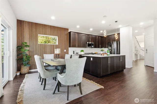 a kitchen with a table and chairs in it