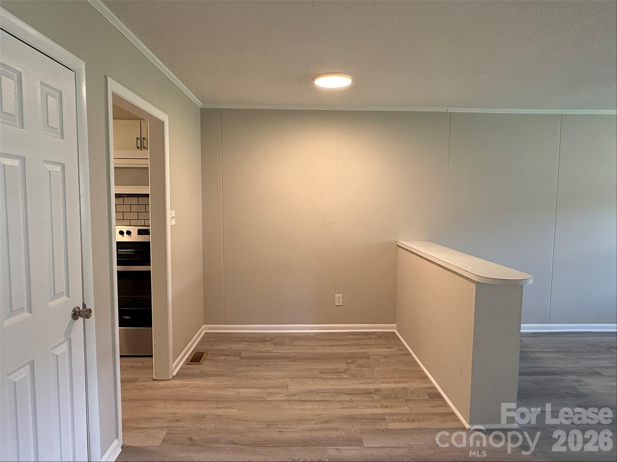 1771 River Road Lincolnton, NC 28092 - Photo 3 of 12 a view of an empty room with wooden floor and closet