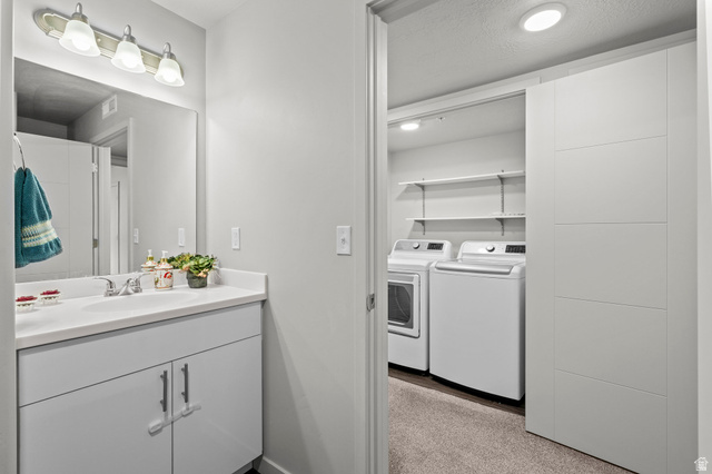 64 West 600 South, Unit C205 Springville, UT 84663 - Photo 17 of 28 Bathroom featuring vanity and independent washer and dryer