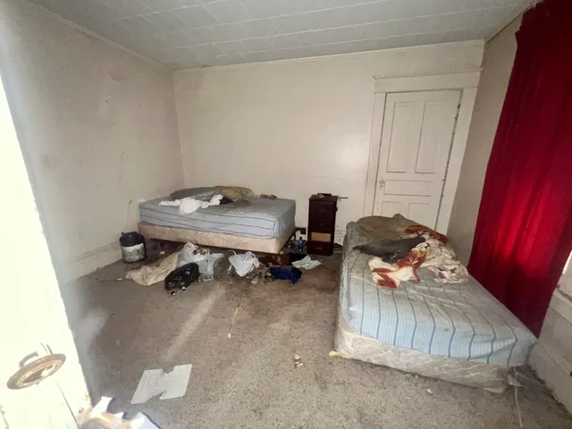 a room with furniture and gym equipment