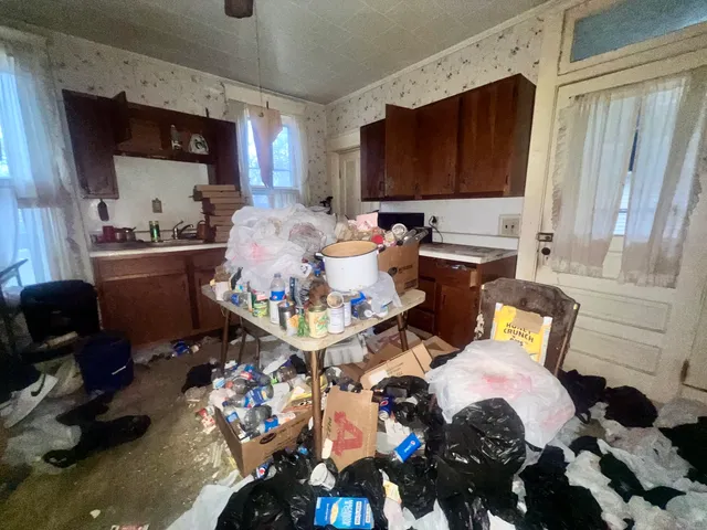 a kitchen with a sink appliances and cabinets