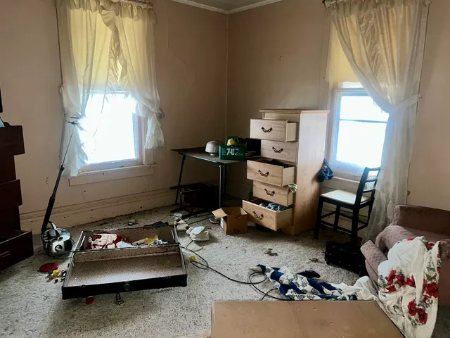 a bedroom with furniture and a window