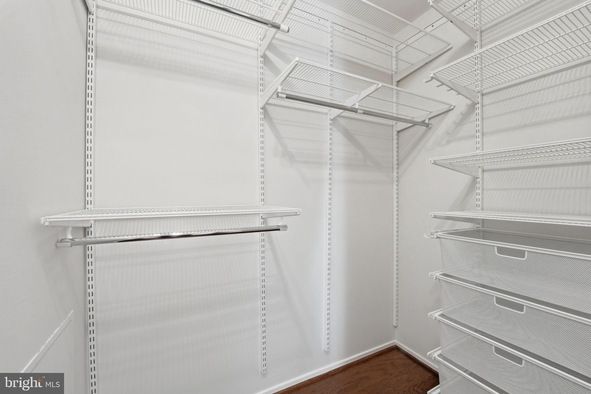 2817 Jermantown Road, Unit 107 Oakton, VA 22124 - Photo 14 of 28 a view of walk in closet with empty racks