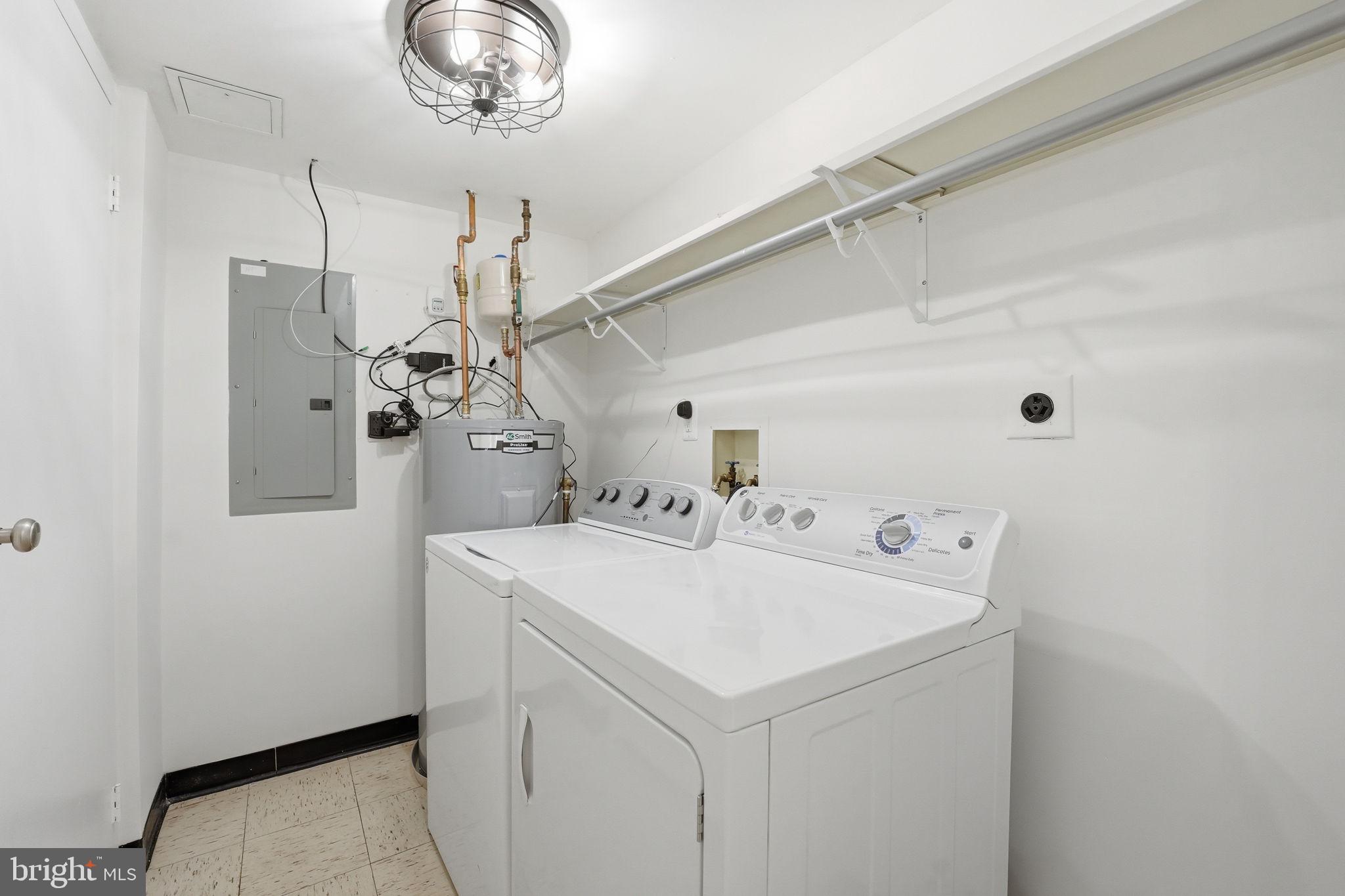 2817 Jermantown Road, Unit 107 Oakton, VA 22124 - Photo 17 of 28 a utility room with dryer and washer