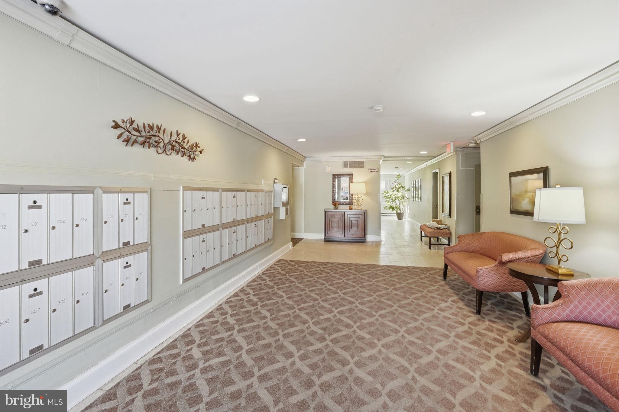 2817 Jermantown Road, Unit 107 Oakton, VA 22124 - Photo 24 of 28 a living room with furniture