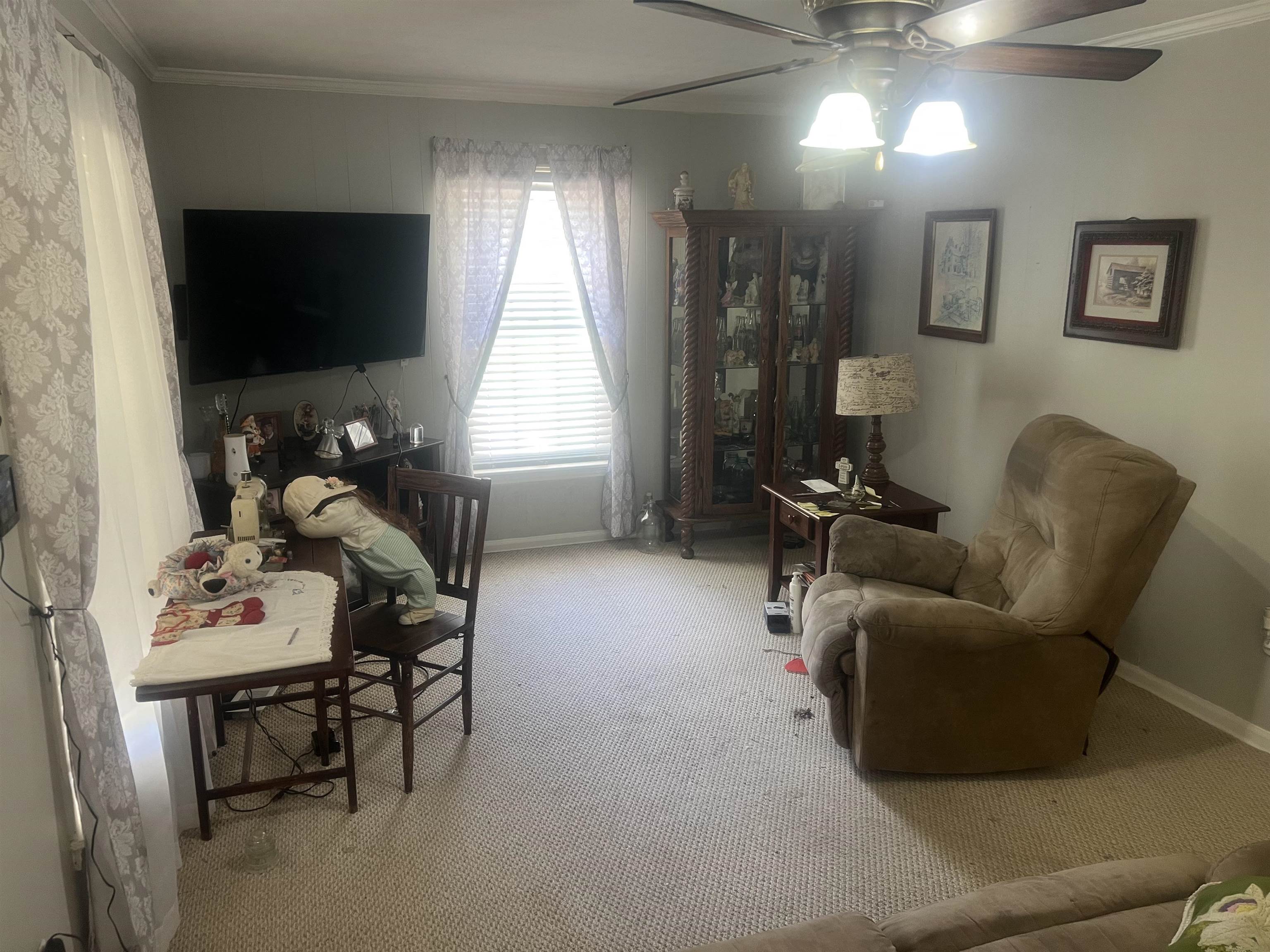 529 Janet Road Bolivar, TN 38008 - Photo 5 of 16 Carpeted interior space featuring a ceiling fan with integrated lighting
