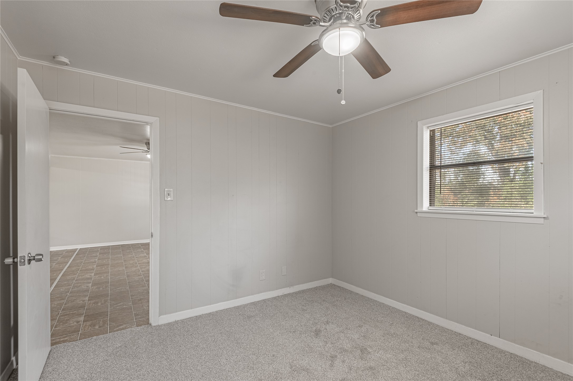 525 12th Street, Unit 7 Huntsville, TX 77340 - Photo 13 of 21 an empty room with a window and a fan
