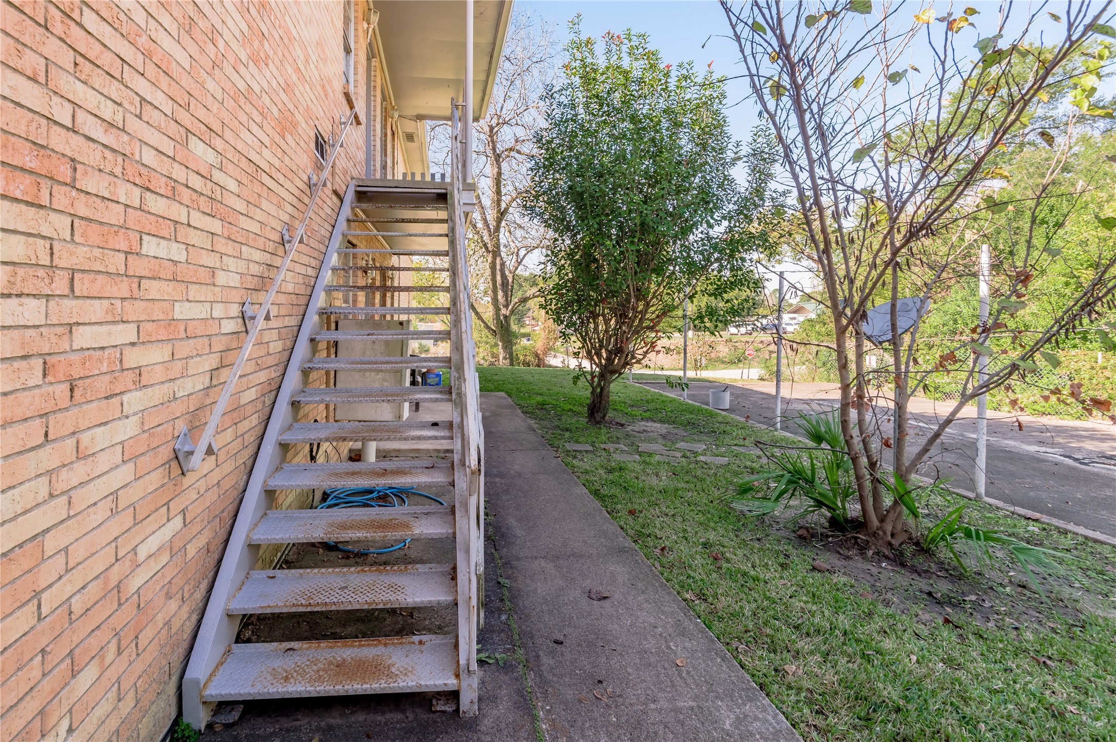 525 12th Street, Unit 7 Huntsville, TX 77340 - Photo 18 of 21 a front view of a house with a yard