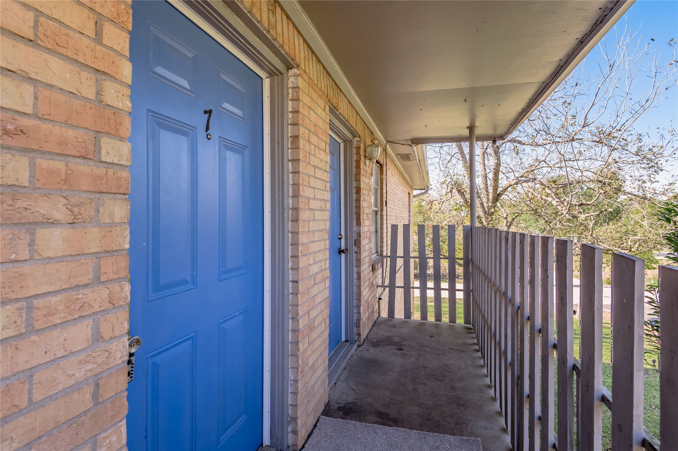 525 12th Street, Unit 7 Huntsville, TX 77340 - Photo 2 of 21 a view of a house with a backyard