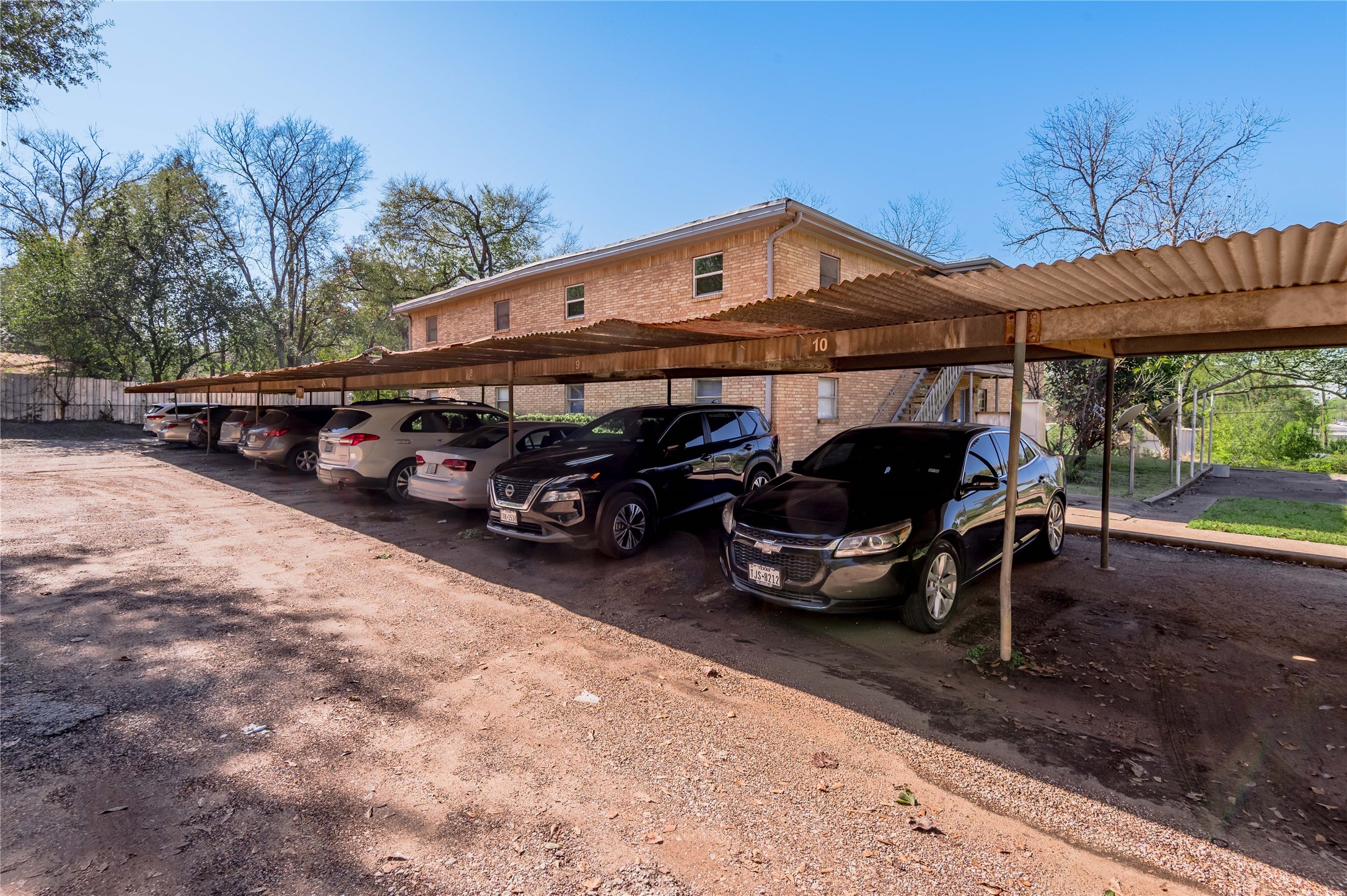 525 12th Street, Unit 7 Huntsville, TX 77340 - Photo 21 of 21 a front view of a house with cars parked