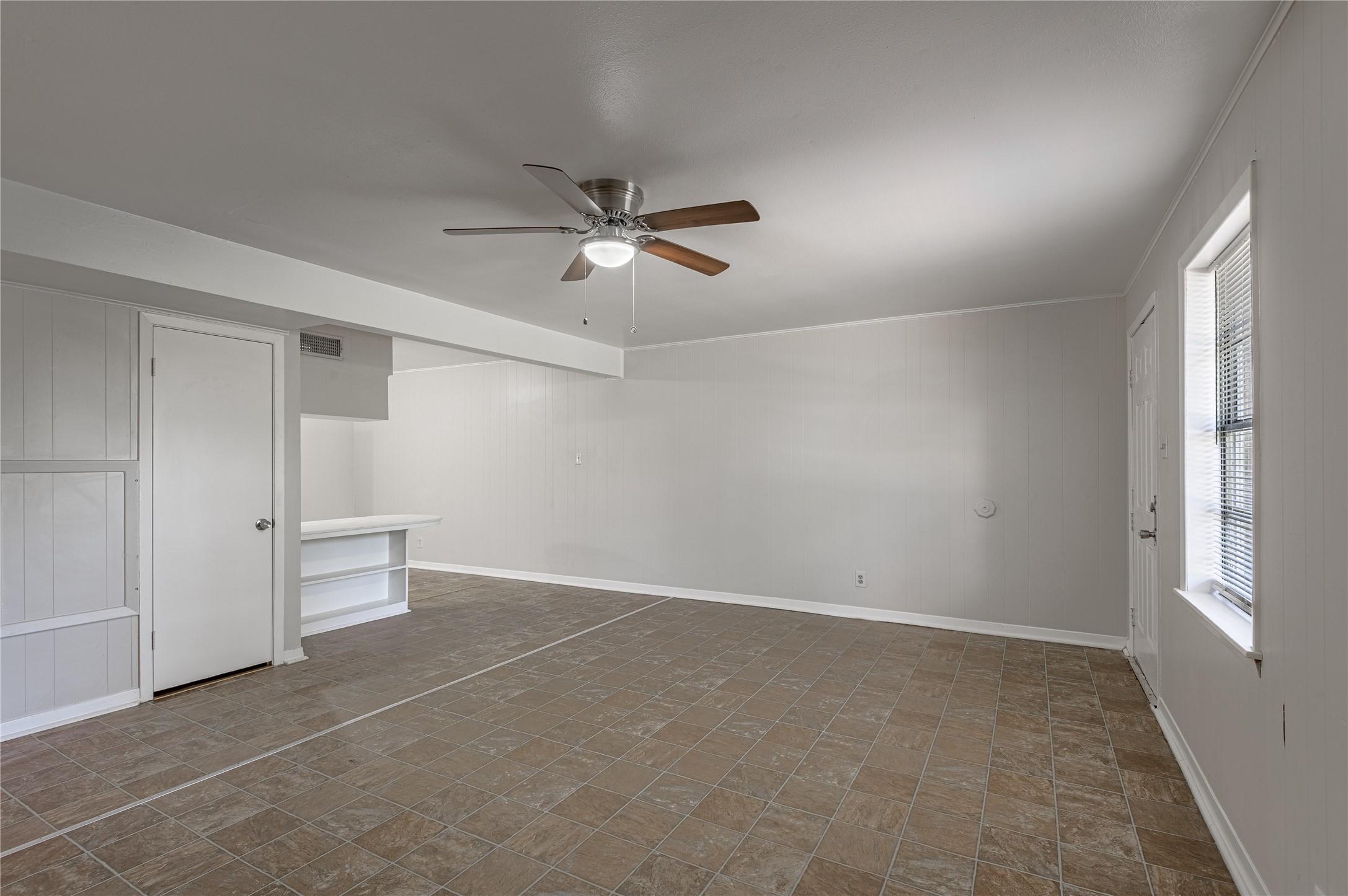 525 12th Street, Unit 7 Huntsville, TX 77340 - Photo 6 of 21 an empty room with closet and windows