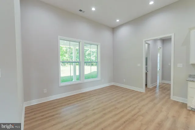 a large kitchen with a large counter top appliances and cabinets