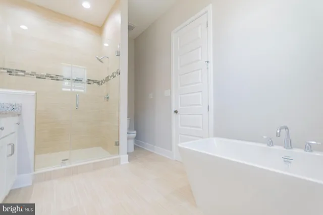 a bathroom with a sink a toilet and a bathtub