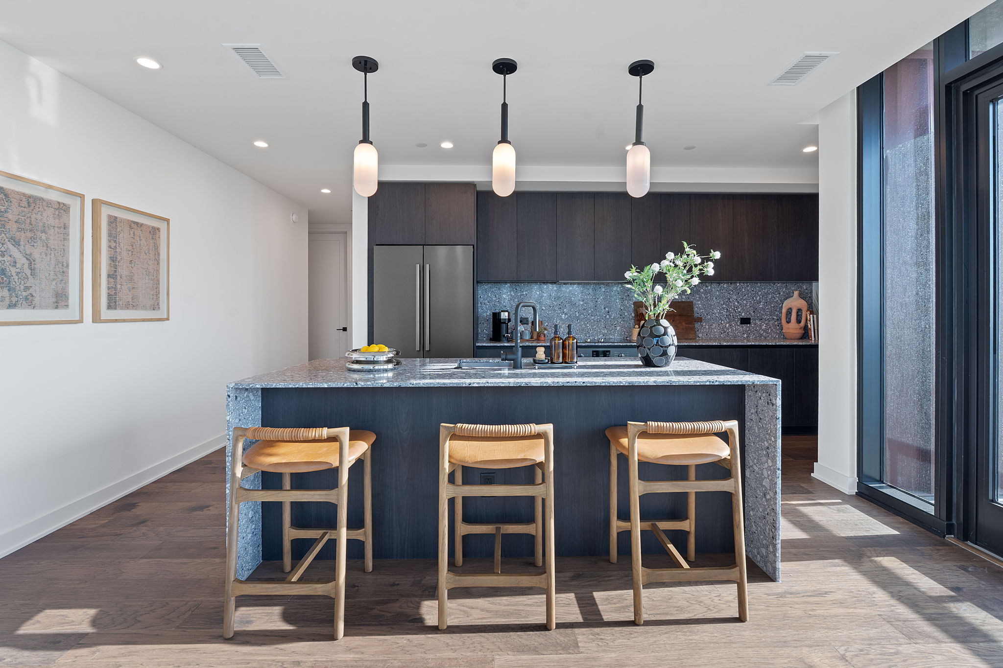 84 East Avenue, Unit 1906 Austin, TX 78701 - Photo 2 of 36 a kitchen with a table and chairs in it