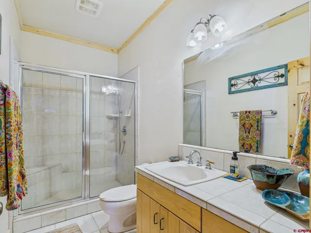 a view of hallway with wooden floor