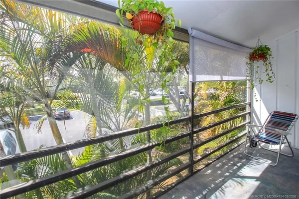 a view of a bunch of flowers in a balcony