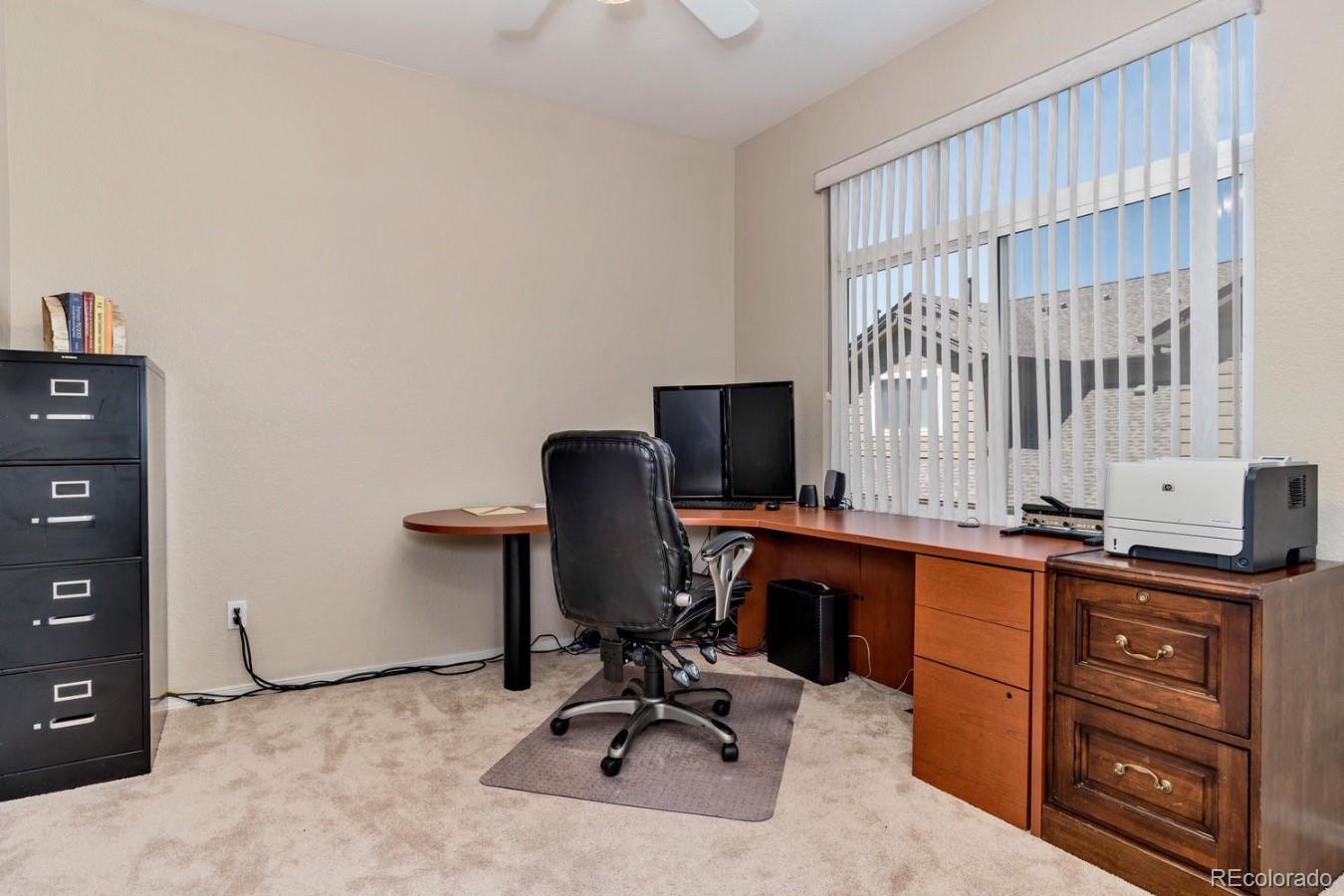 6486 Silver Mesa Drive, Unit B Highlands Ranch, CO 80130 - Photo 13 of 29 a view of a workspace with furniture and a window
