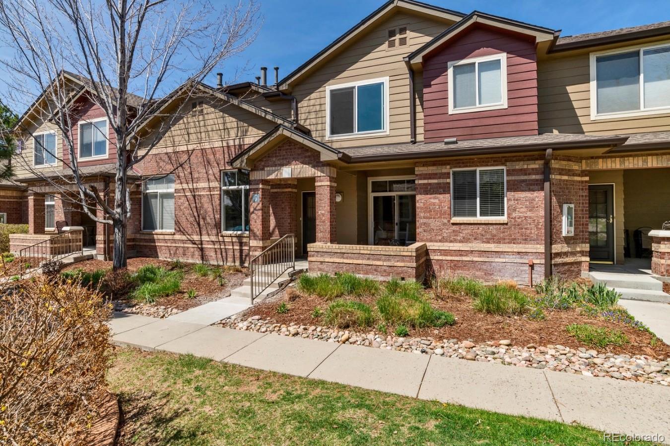 6486 Silver Mesa Drive, Unit B Highlands Ranch, CO 80130 - Photo 2 of 29 a front view of a house with garage