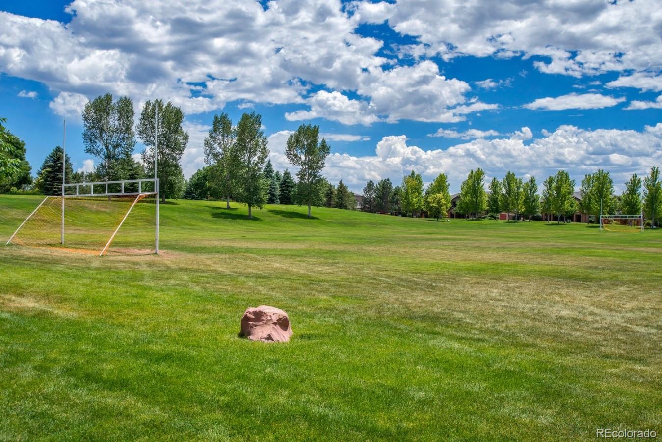6486 Silver Mesa Drive, Unit B Highlands Ranch, CO 80130 - Photo 23 of 29 a view of a playground with basketball court