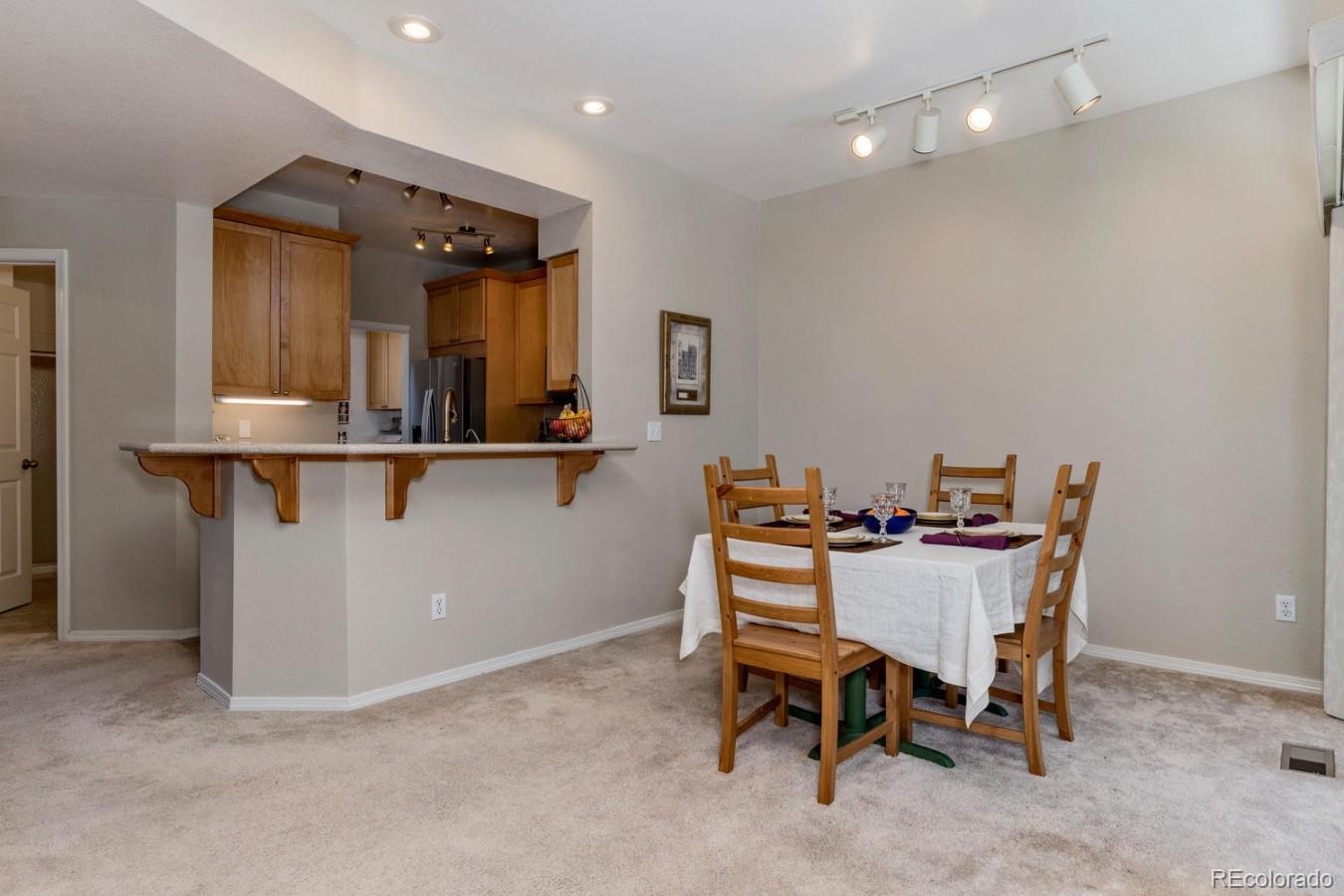 6486 Silver Mesa Drive, Unit B Highlands Ranch, CO 80130 - Photo 6 of 29 a view of a dining room with furniture