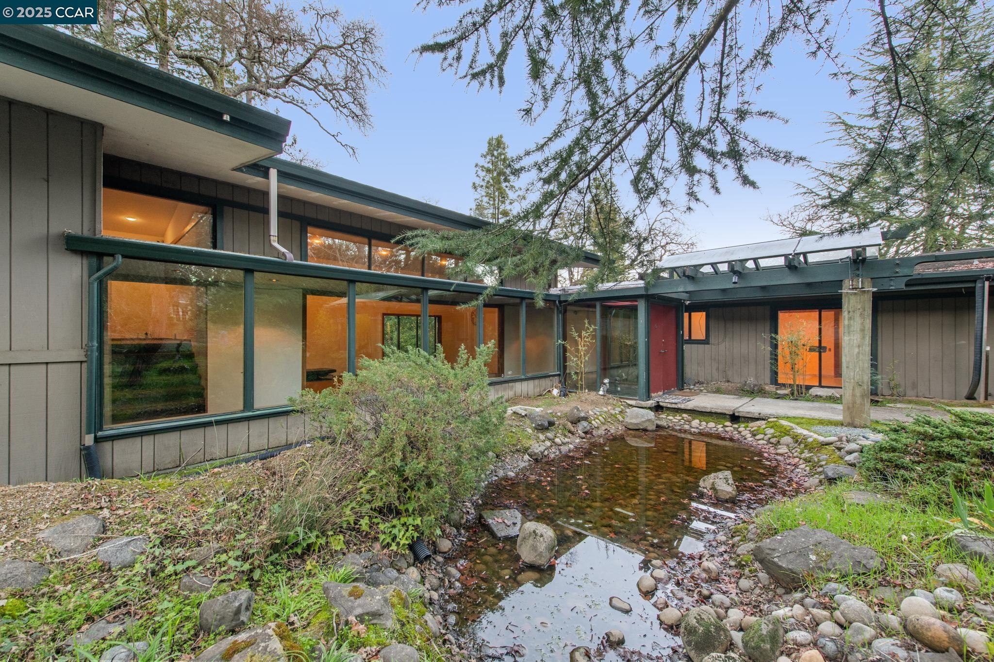 4 Sol Brae Way Orinda, CA 94563 - Photo 1 of 1 a front view of a house with garden