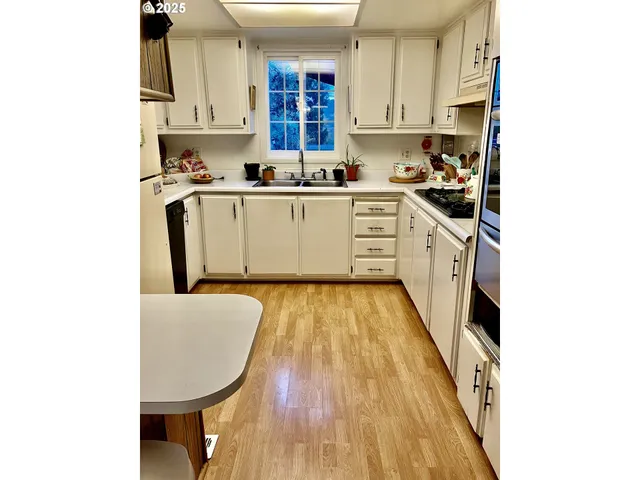 a kitchen with a sink and cabinets