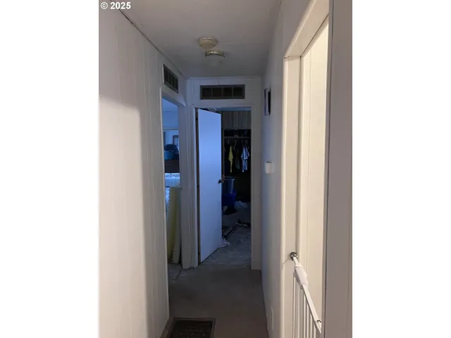 a view of a hallway with closet