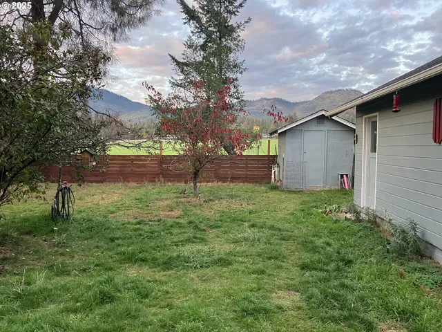 a backyard of a house with lots of green space