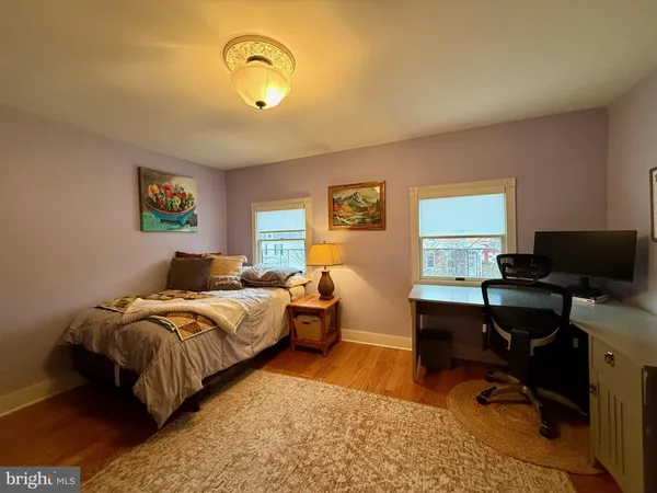 a bedroom with bed and a window