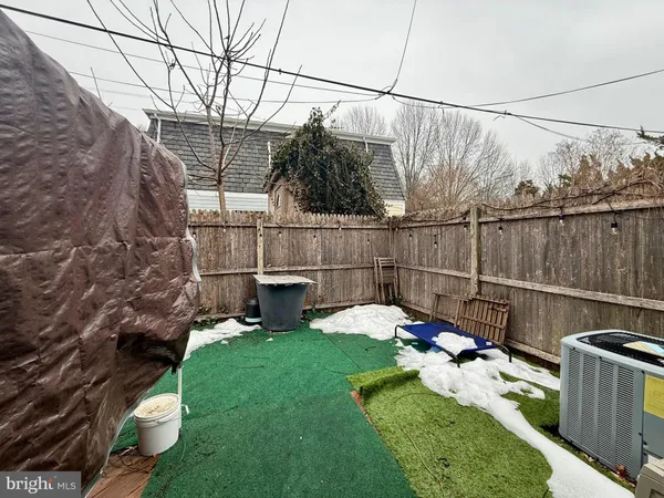 a view of a backyard with sitting area and furniture