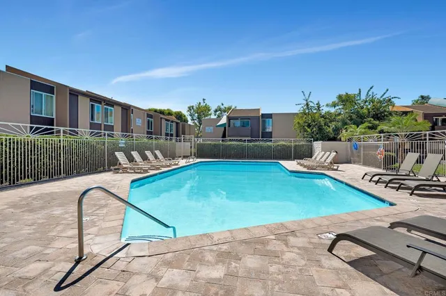 a view of a swimming pool with a lounge chairs