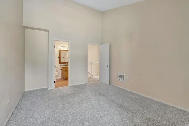 a view of an empty room and fire place