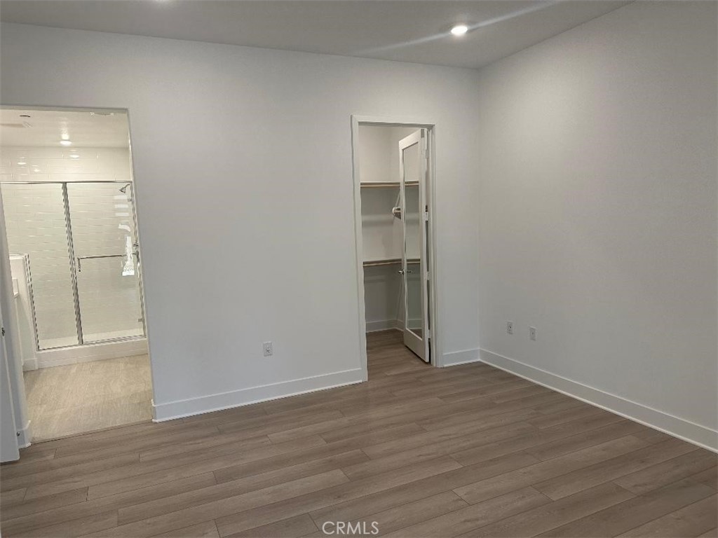 512 Nielson Irvine, CA 92618 - Photo 6 of 14 a view of an empty room with wooden floor and closet