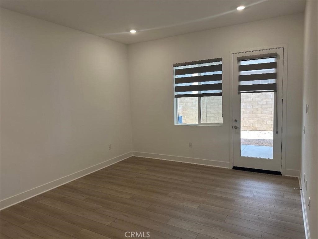 512 Nielson Irvine, CA 92618 - Photo 7 of 14 wooden floor in an empty room with a window